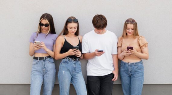 A group of teens on their smartphones