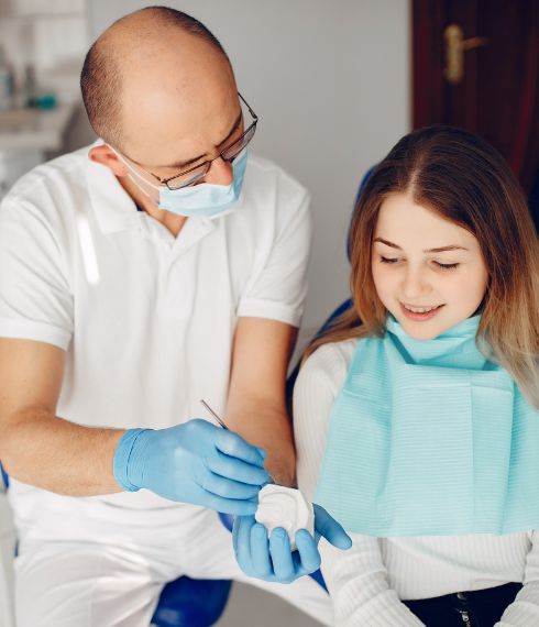 A dentist talking to a patient