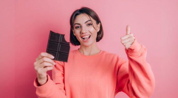 Women holding a bar of chocolate